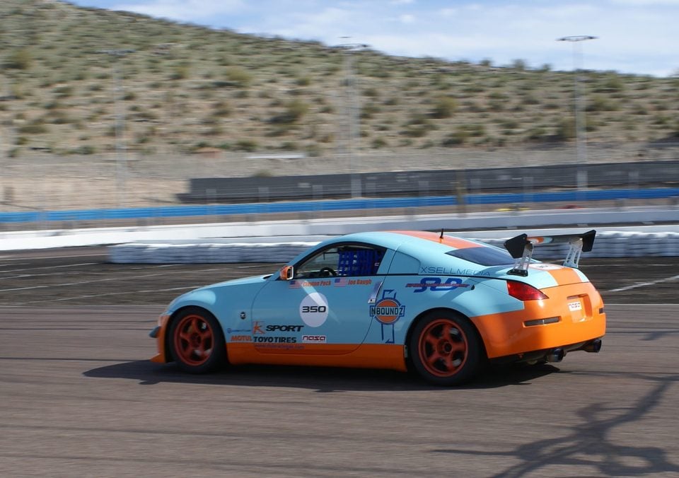 Nissan 350Z race car carrying KSport branding on a circuit