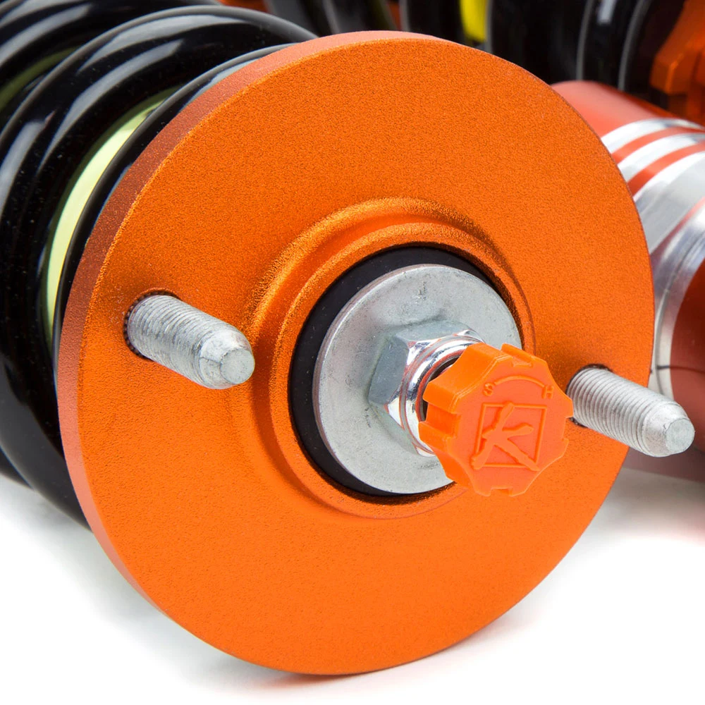 Orange damping adjustment knob on a KSport Kontrol Pro upper mount